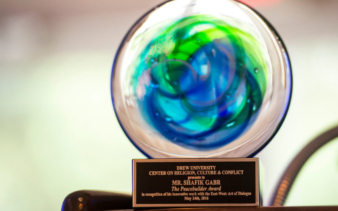 Chairman Shafik Gabr receives the Peacebuilder Award